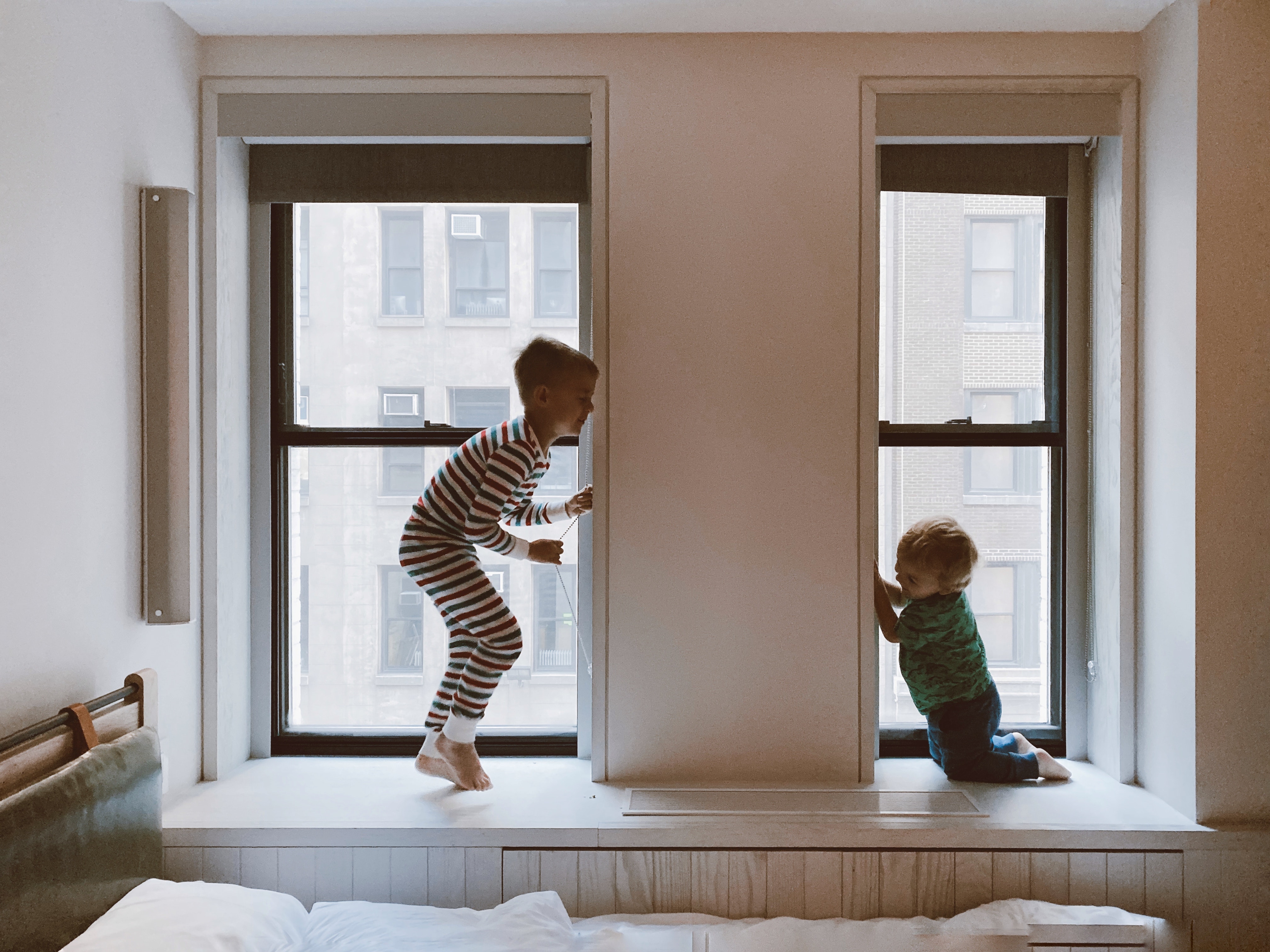 Two Kids two-kids-playing-beside-glass-windows-3273851.jpg